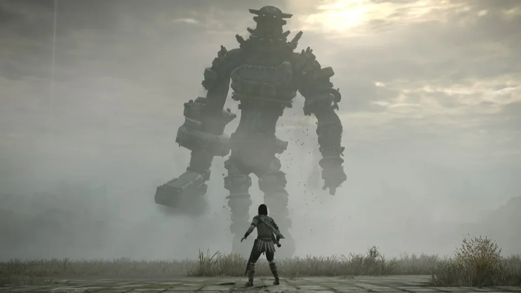 Shadow of the Colossus'tan bir ekran görüntüsü. Taştan bir dev ve bir kadının karşılaşmasını gösteriyor.